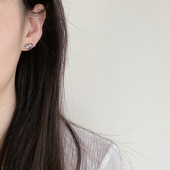 European and American simple design, knotted, entangled, twisted, small studs, niche, delicate, retro, high-end, silver needle earrings, women Glossy.pk
