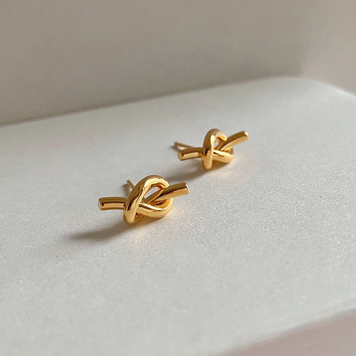 European and American simple design, knotted, entangled, twisted, small studs, niche, delicate, retro, high-end, silver needle earrings, women Glossy.pk