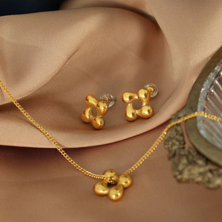 New light luxury, exquisite, fashionable, versatile, temperament, personality, rotating flowers, titanium steel necklaces, niche stud earrings set wholesale Glossy.pk