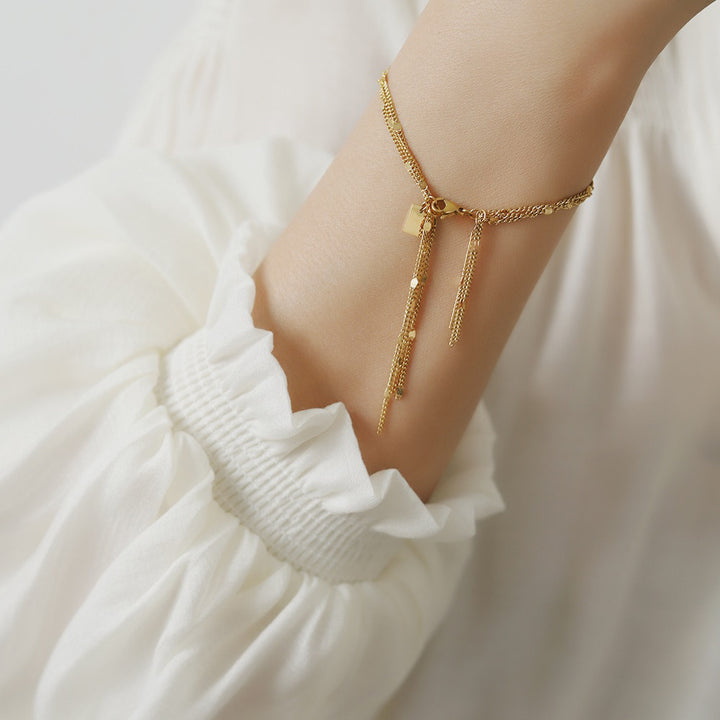 European and American sense of luxury, niche, light luxury, sparkling, three-layer tassel gentle bracelet, titanium steel plated with 18K gold, does not fade