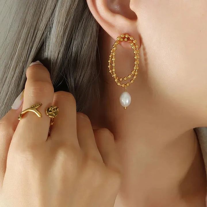 European and American retro pearl titanium steel stud earrings women's niche design sense K gold bead chain light luxury cold wind drop earrings