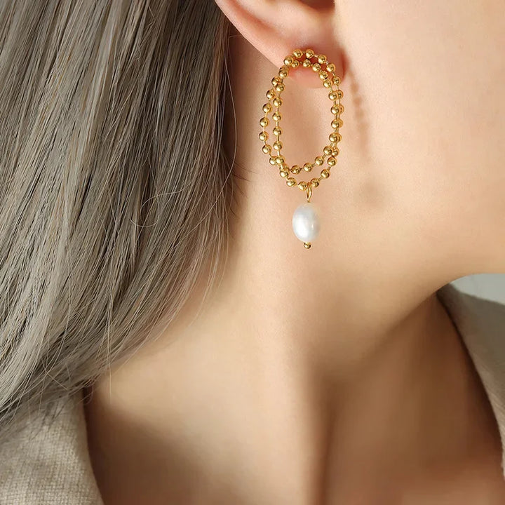 European and American retro pearl titanium steel stud earrings women's niche design sense K gold bead chain light luxury cold wind drop earrings