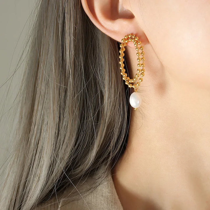 European and American retro pearl titanium steel stud earrings women's niche design sense K gold bead chain light luxury cold wind drop earrings