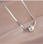 Double-layer transfer ball, light luxury necklace, titanium steel, non-fading, temperament, high-quality clavicle chain, girlfriend female neckband, sweater chain Glossy.pk