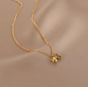 Ribbon Water‑Drop Clavicle Necklace — Gold Tone product photo 2 | Glossy.pk Pakistan