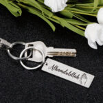 Cross-border hot sale stainless steel small strip personality creative tranquility prayer stainless steel small strip keychain pendant Glossy.pk