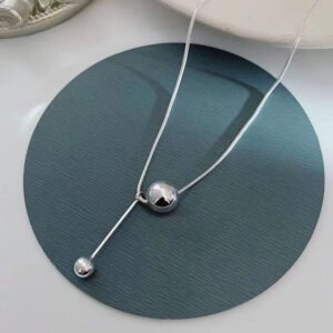 Light-Luxury Collarbone Chain — Round Ball Detail (Gold & Steel) product photo 4 | Glossy.pk Pakistan