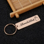 Cross-border hot sale stainless steel small strip personality creative tranquility prayer stainless steel small strip keychain pendant Glossy.pk