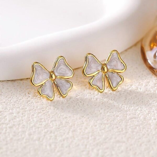 Bow Stud Earrings (Black, White) product photo 4 | Glossy.pk Pakistan