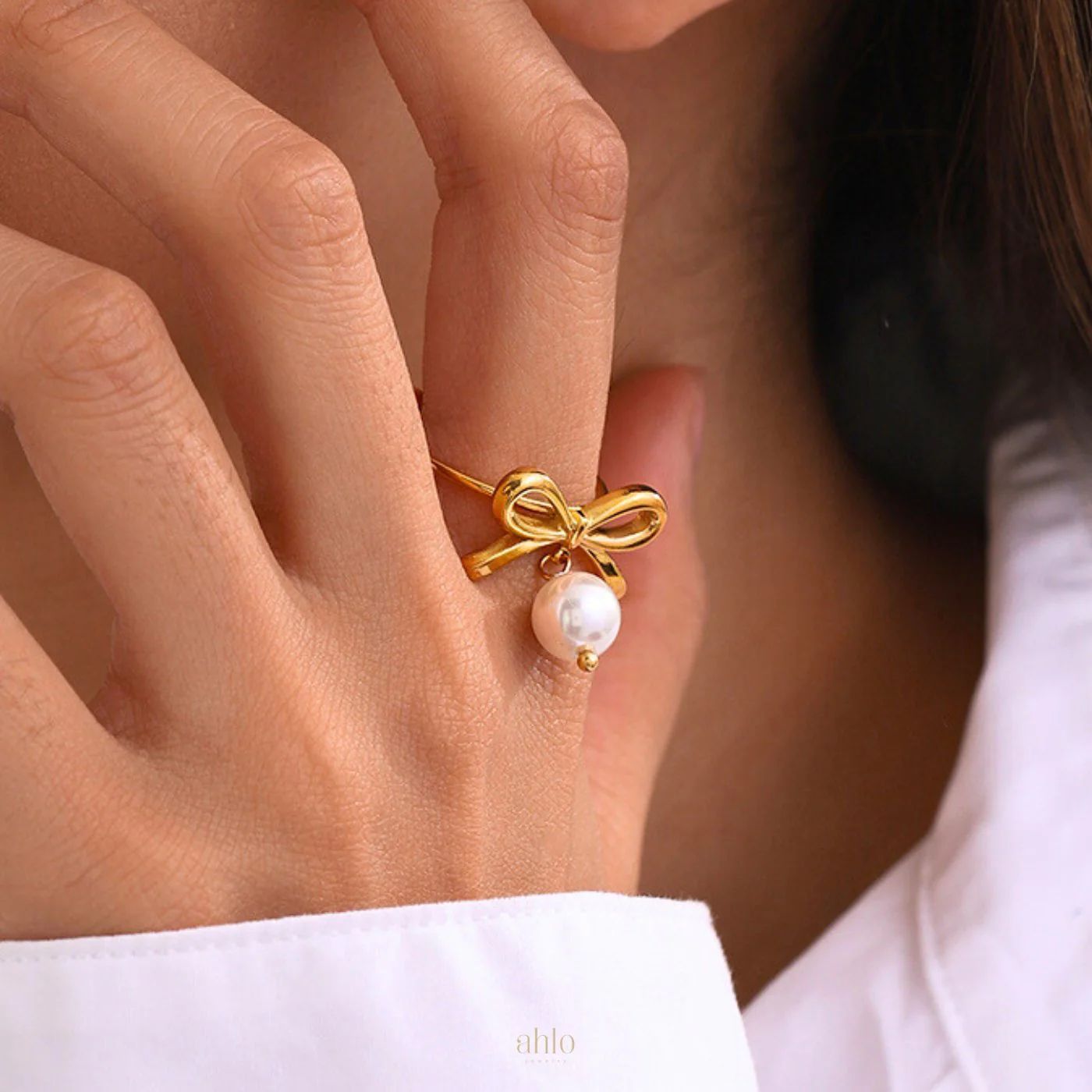 rn-image_picker_lib_temp_2d37de91-2cb5-435a-84cf-11bd32ddf30a Bow style ring with pearl - Image 1