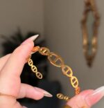 CD. Branded handcuff