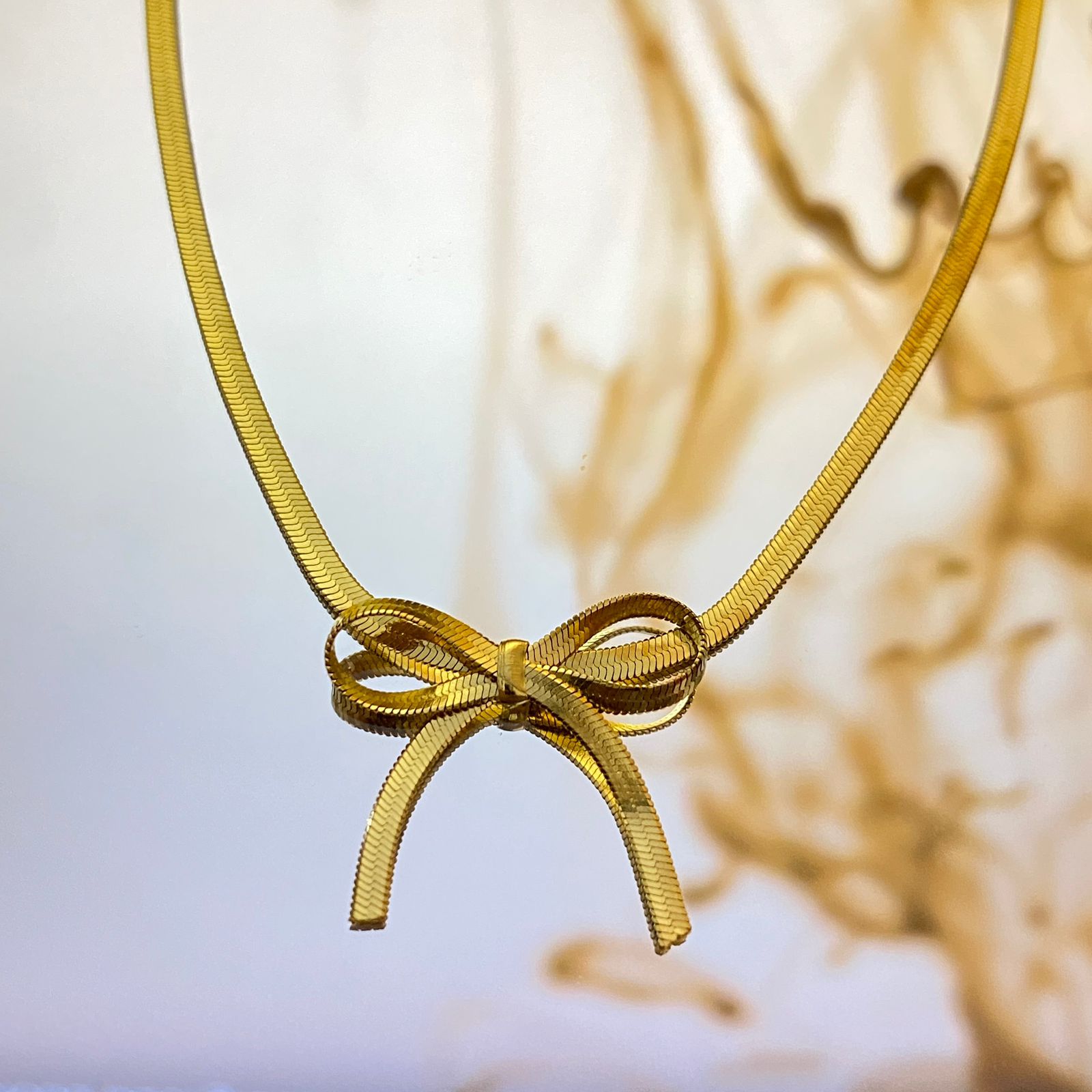 7354eb87-85d5-42fd-b298-b693655255ad Snake Chain Bow-Pendent - Image 1