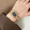 Cosmo Gold Bangle Watch — Black Dial — jewellery from Glossy.pk, Pakistan
